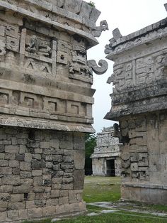 two stone structures with carvings on them