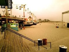 the boardwalk is empty and people are walking around