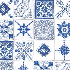 blue and white tiles with different designs on them