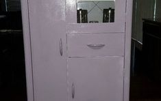 a white refrigerator freezer sitting inside of a kitchen