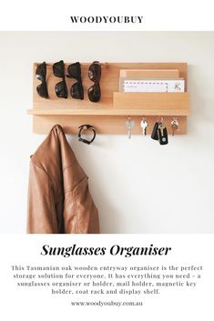 a wooden shelf with shoes and other items hanging on it's side, next to a coat rack