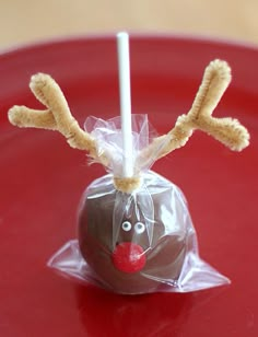 a chocolate covered apple with reindeer antlers on it