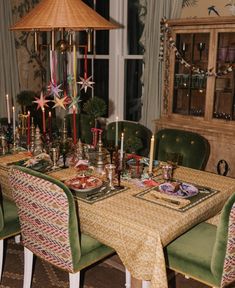 a dining room table set for christmas dinner