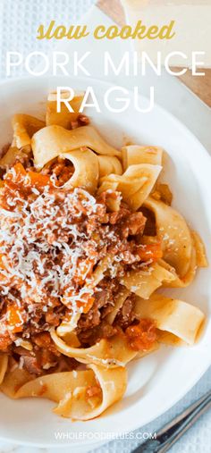 a white bowl filled with pasta and sauce