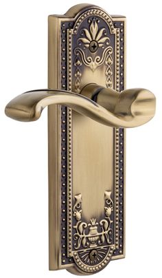 an ornate brass door handle on a white background