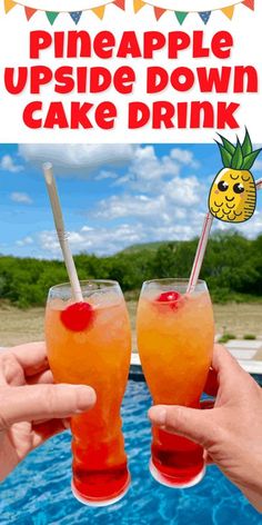 two people holding up drinks with the words pineapple upside down cake drink