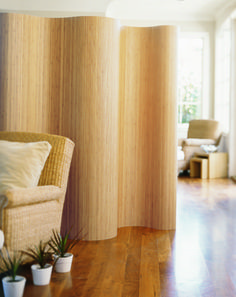 an empty living room with wood paneling on the walls