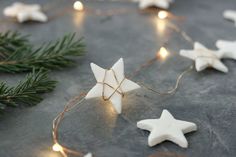 some white stars and lights on a table