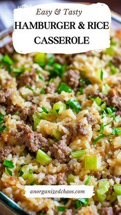 hamburger and rice casserole in a glass dish with green onions on the side