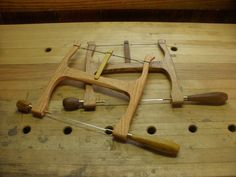 some tools are laying on a wooden table