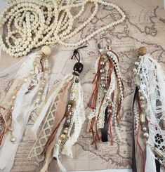 an assortment of beads and laces are laid out on a map