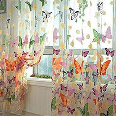 the curtains are decorated with butterflies on them