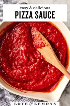 pizza sauce in a white bowl with a wooden spoon on the side and text overlay that reads easy and delicious pizza sauce