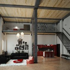 a living room filled with furniture and a staircase