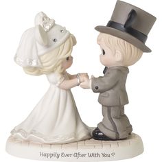 a figurine is holding hands with a little boy in a suit and top hat