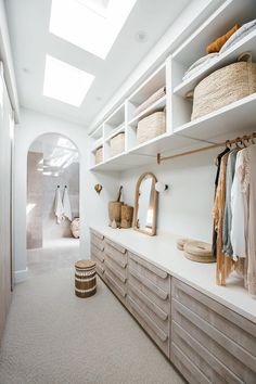 an instagram photo of a closet with clothes hanging on the shelves and other items