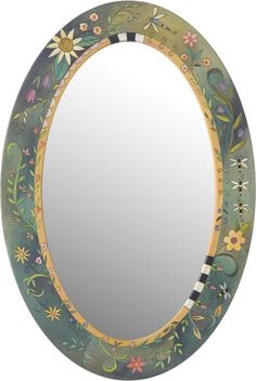 a round mirror with flowers painted on it