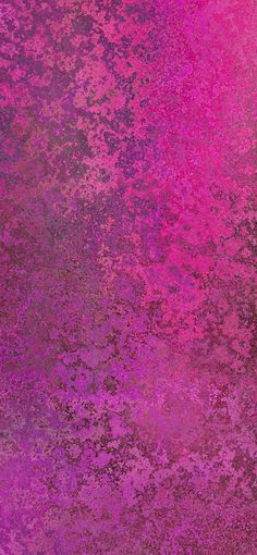 an abstract pink and purple background with lots of small speckles on the surface