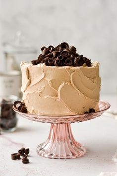 a frosted cake with chocolate chips on top