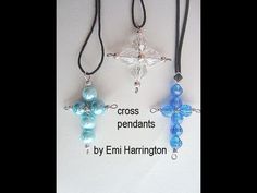 three cross pendants with different colors and designs