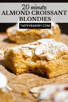 two pieces of almond croissant blondies sitting on top of a cutting board