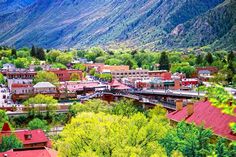 the city is surrounded by mountains and trees