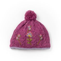 Introducing the Blooms Beanie, a perfect blend of style and warmth for your winter wardrobe. This cozy beanie features delicate embroidered blossoms set against a classic cable knit design. Finished with a playful pompom and a rolled edge in a complementary color, the Blooms Beanie is both fashionable and functional. The fleece-lined band ensures extra warmth and comfort, making it ideal for chilly days. Available in a variety of beautiful colorways, each offering its own unique charm, this bean Holiday Gift Card, Kids Holiday Gifts, Sweater Hat, Boys Sweaters, Girls Sweaters, Holidays With Kids, Complementary Colors, Unique Charms, Hand Warmers