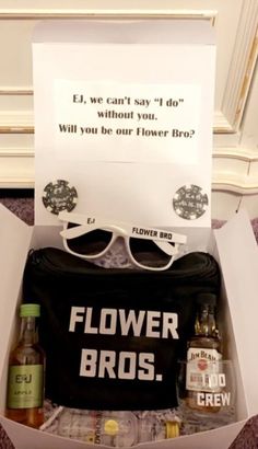 an open box with some drinks in it and a sign that says, flower bros