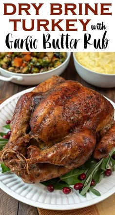 a roasted turkey with garlic butter and cranberries on a white plate