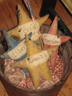 an old wooden basket filled with star ornaments