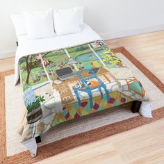 a bed with a colorful comforter on top of it