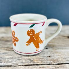 a coffee cup decorated with gingers and leaves