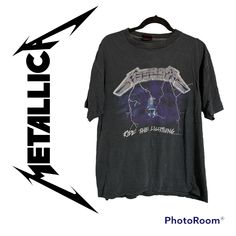 a black shirt with the words metallic on it and lightning bolt in front of it