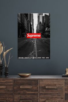 a black and white photo with the word supreme on it in red over a city street