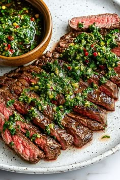 Treat yourself to this incredible chimichurri steak! The combo of tender flank steak and flavorful sauce is a match made in heaven. Flank Steak Chimichurri, Marinated Skirt Steak, Steak With Chimichurri Sauce, Chimichurri Steak, Steak Marinades, Grilled Skirt Steak, Chimichurri Recipe, Flank Steak Recipes, Grilled Flank Steak