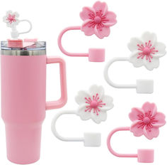 pink and white flower shaped hair clips, cups and mugs are shown in front of each other