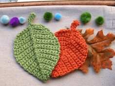 crocheted leaves and acorns laid out on a table