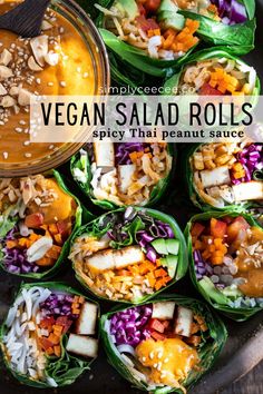 an overhead view of several vegetable wraps on a plate with a bowl of dipping sauce