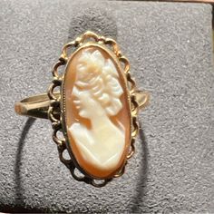 Condition: Pre-Owned / Good Condition, No Damage Style: Left Facing Carved Shell Cameo Ring Metal: 10k Plum Gold Maker: Plainville Stock Company Markings: 10k Psco-P Stone Type: Carved Shell Cameo Size: 16.4mm (.64”) X 8.6mm (.33”) Ring Top: 19.1mm (.75”) X 11.3mm (.44”) Band Width: 1.5mm - 2.5mm Ring Size: 7.5 Item Weight: 2.3 Grams Cameo Ring, Carved Shell, Ring Metal, Ring Size 7, Metal Rings, Womens Jewelry Rings, Size 16, Vintage Jewelry, Shells