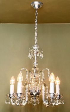 a crystal chandelier hanging from the ceiling