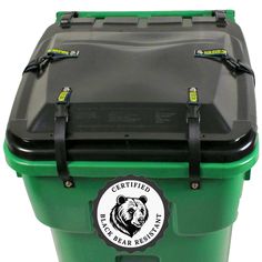 a green and black cooler with a bear sticker on the side, attached to it