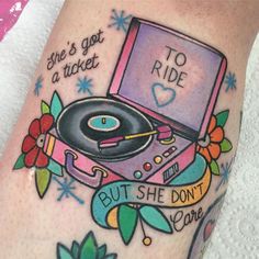 a tattoo with a record player on it