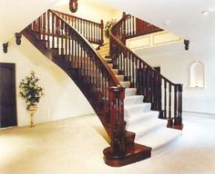 a staircase in a house with white carpet