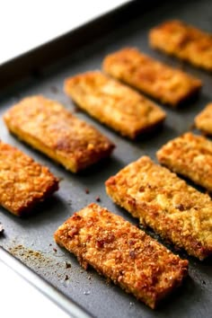 some food that is on a pan and ready to be cooked in the oven for consumption