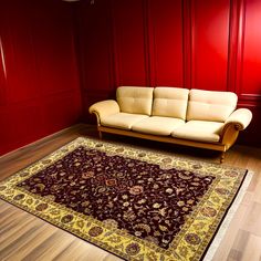 a couch and rug in a room with red walls