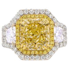 a fancy yellow and white diamond ring