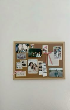 a cork board with pictures and magnets attached to it