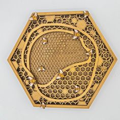 an intricately designed clock is shown on the wall