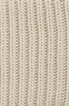 close up view of white knitted fabric