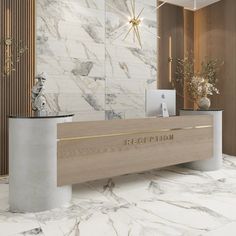 the reception desk is decorated with marble and gold accents